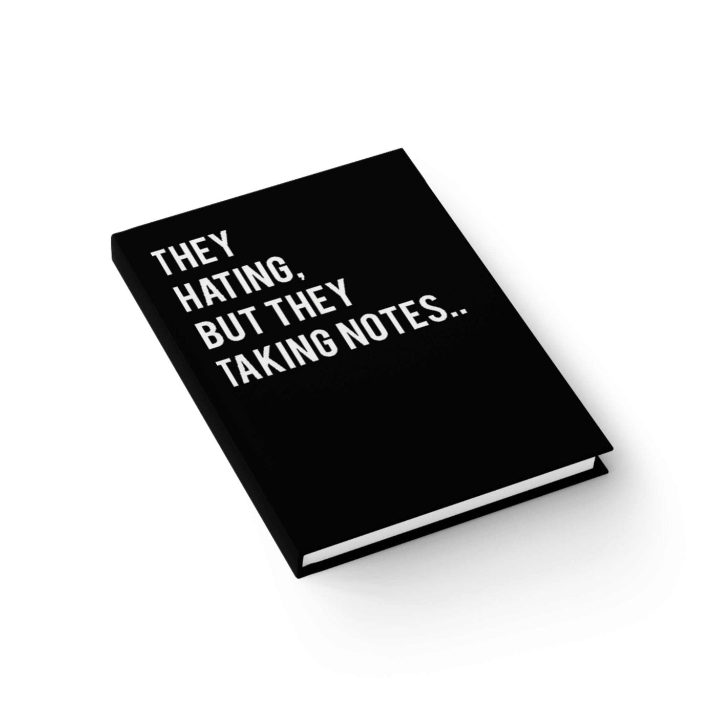 Student workspace: ART WE ALL Sassy Note-Taking journal next to laptop and sketchpad  bold and confident design