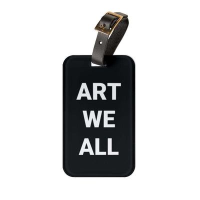 Creative luggage tag with black acrylic base and white "ART WE ALL" text, featuring an adjustable black leather strap for personalized travel accessory.